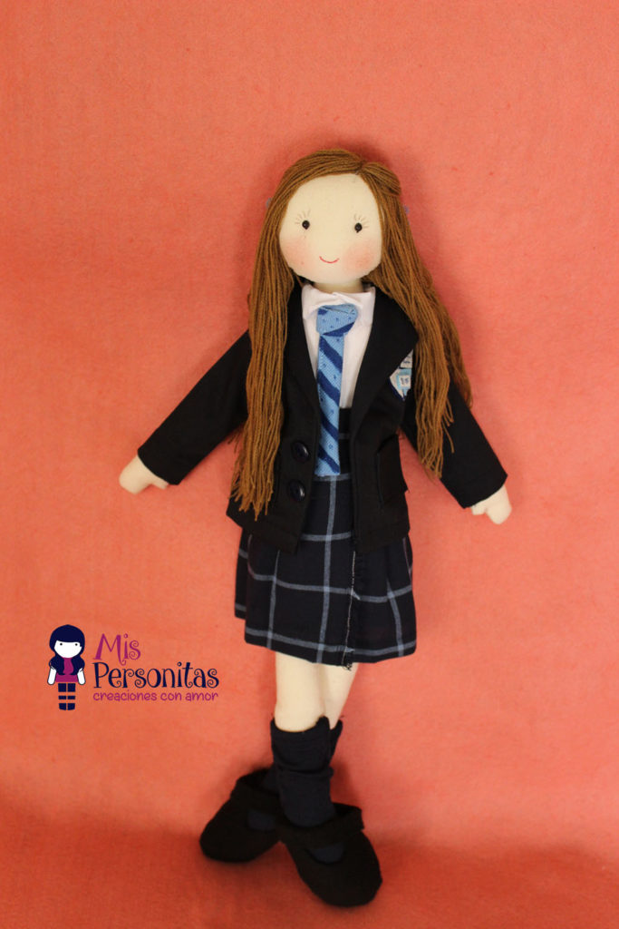Muñeca de tela escolar