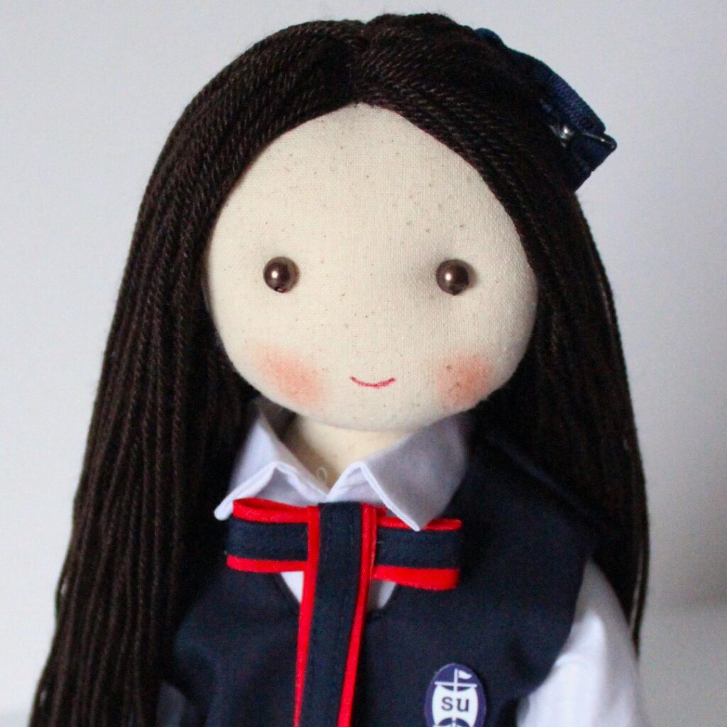 muñeca escolar
